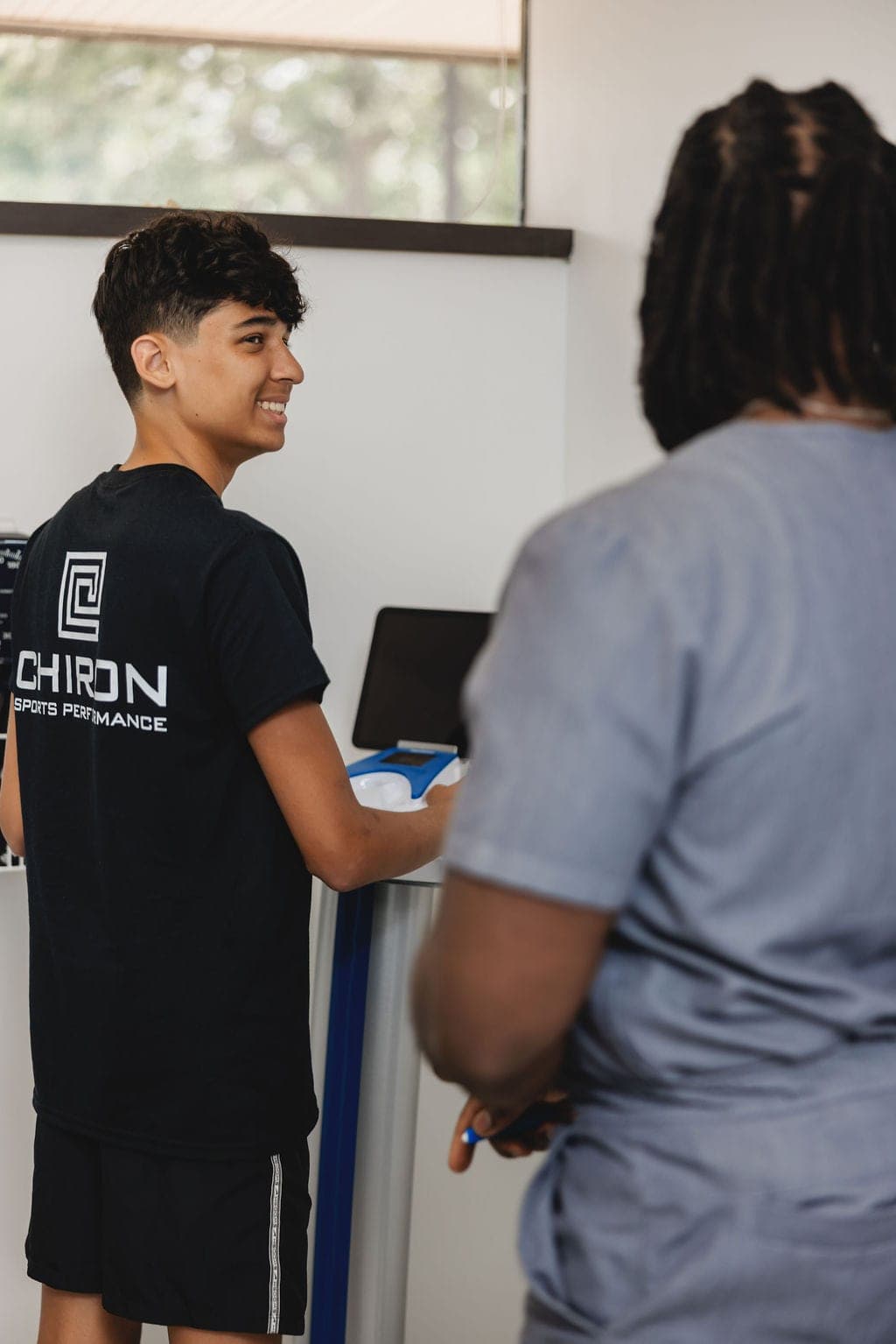 Athlete reviewing assessment results with the Chiron team
